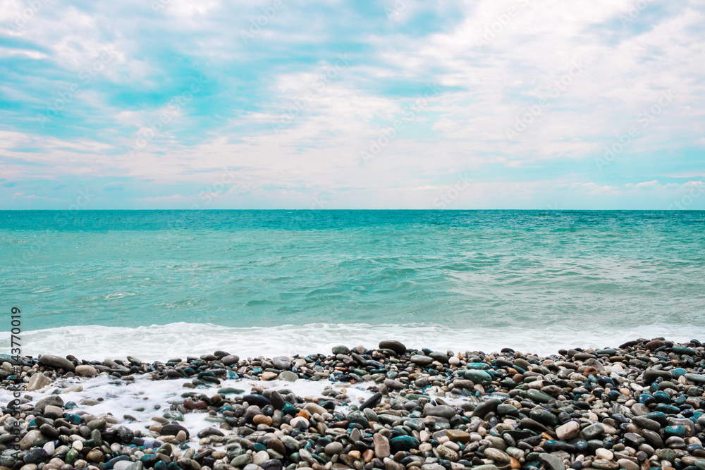 Beach with pebbles, sea with waves and sea foam. Beach with pebbles, sea with waves and sea foam.