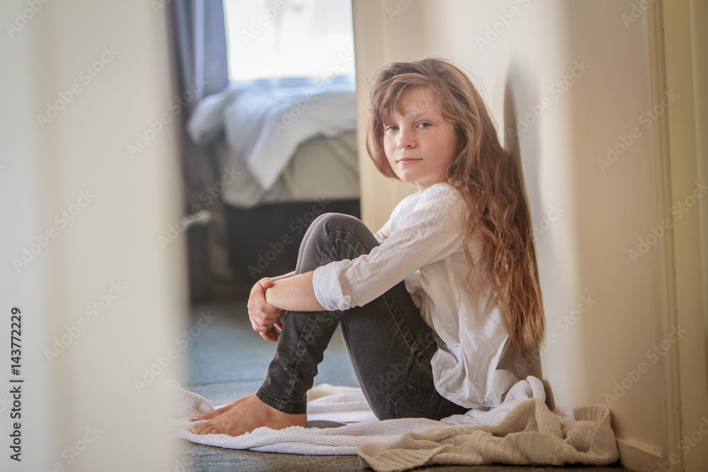 indoor portrait of young preteen girl at home