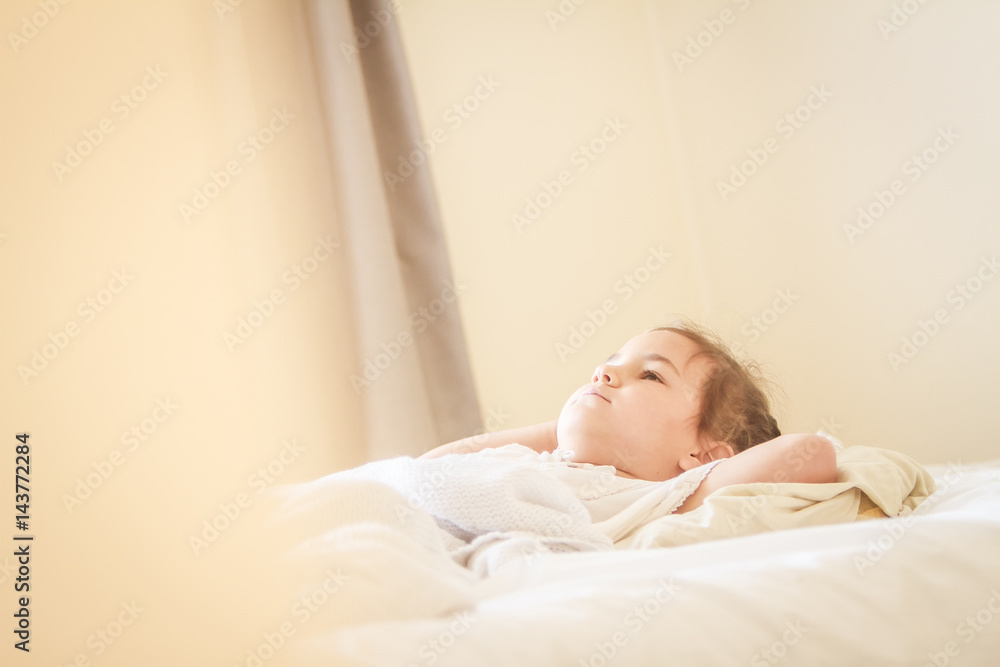 indoor portrait of young child girl wrapped in blanket indoor portrait of young child girl wrapped in blanket