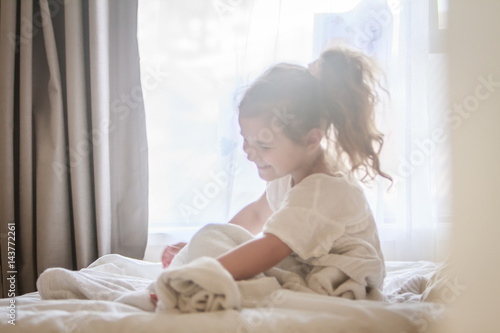 Wallpaper Mural indoor portrait of young child girl wrapped in blanket Torontodigital.ca