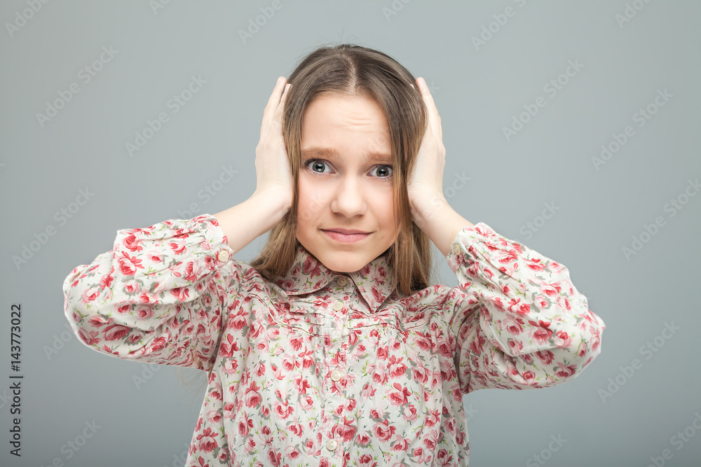 teen closes her ears with hands teen closes her ears with hands