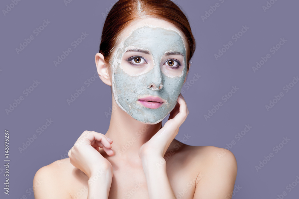 photo of beautiful young woman with mask on her face on the wonderful grey background photo of beautiful young woman with mask on her face on the wonderful grey background