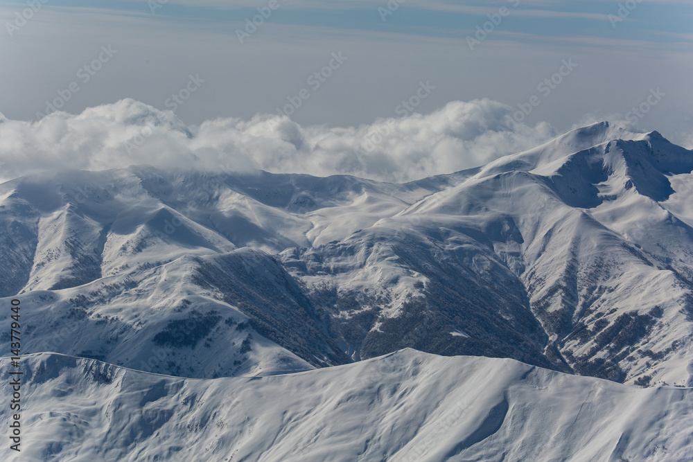 Beautiful winter landscape with snow-topped mountains. Ski resort