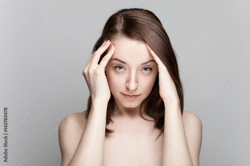 Isolated on gray background studio portrait of young brunette with manicure on nails Isolated on gray background studio portrait of young brunette with manicure on nails