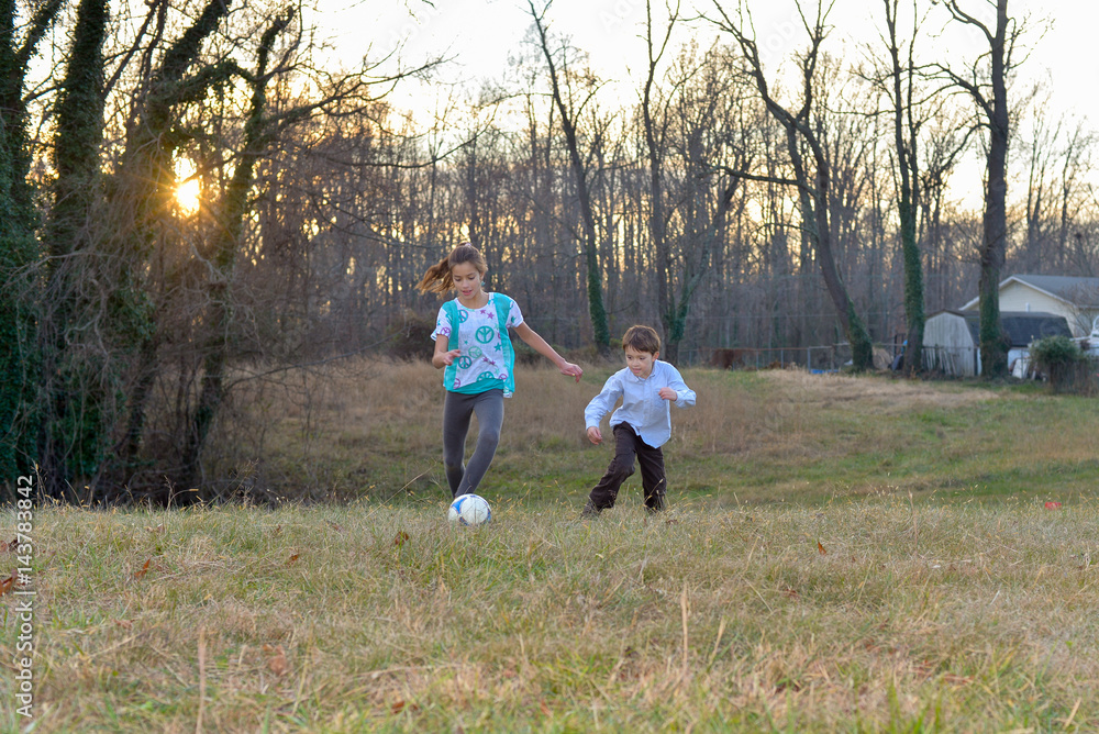 Brother and Sister playing soccer Brother and Sister playing soccer