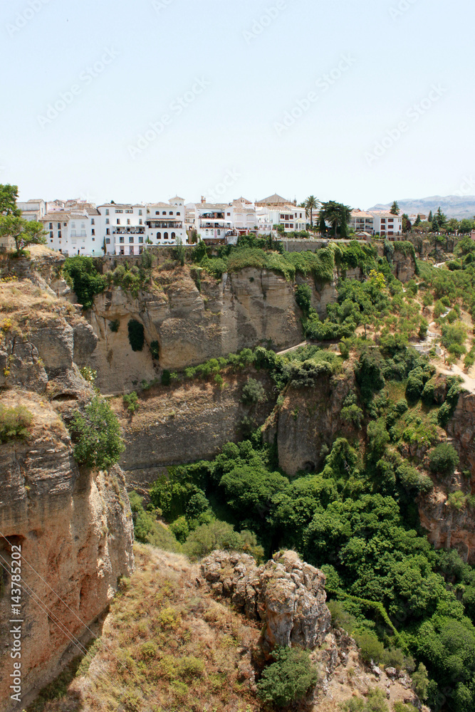 Spain. Andalucia. Ronda. White houses on the rock vertical view.