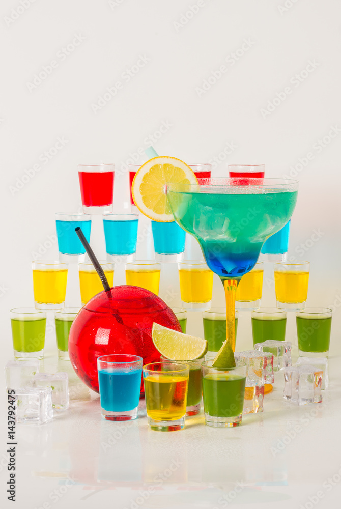 Fototapeta Colorful set of drinks, color drink decorated with fruit, many color kamikaze drink, shot drinks