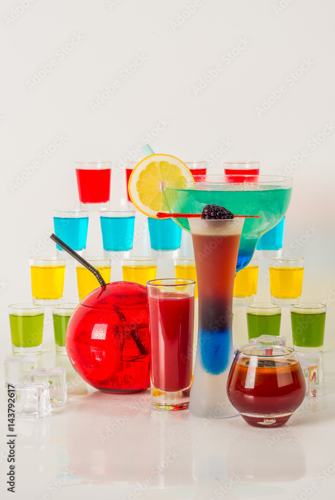 Colorful set of drinks, color drink decorated with fruit, many color kamikaze drink, shot drinks