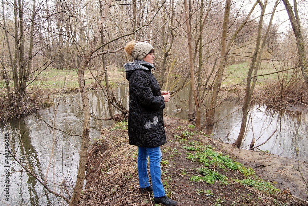 Woman in the spring near the river Woman in the spring near the river