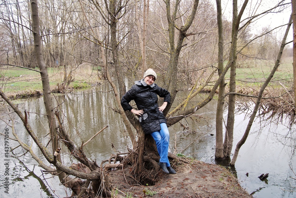 Woman in the spring near the river Woman in the spring near the river