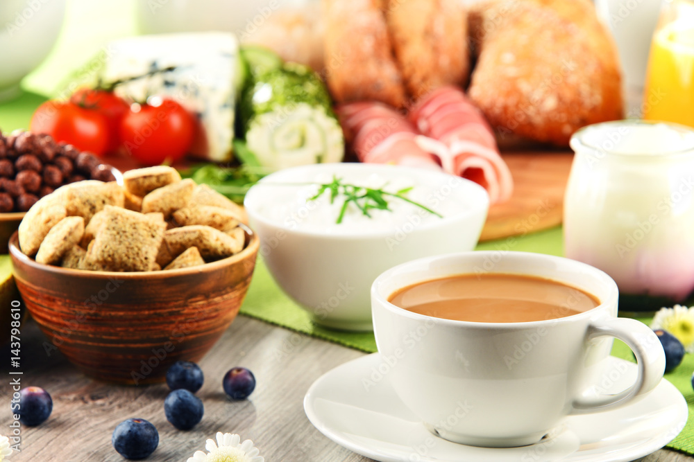 Breakfast served with coffee, cheese, cereals and scrambled eggs Breakfast served with coffee, cheese, cereals and scrambled eggs