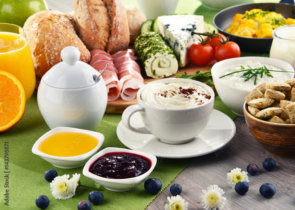 Breakfast served with coffee, cheese, cereals and scrambled eggs Breakfast served with coffee, cheese, cereals and scrambled eggs
