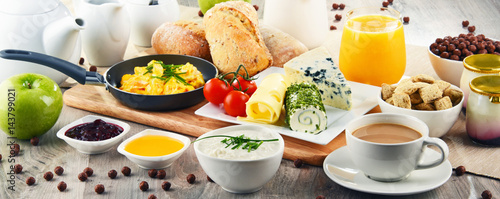 Breakfast served with coffee, cheese, cereals and scrambled eggs