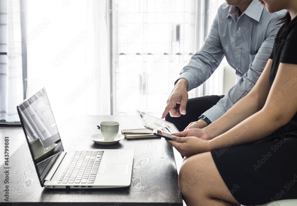 Businessman pointed a finger at notebook,boss pointing on mistakes at office,notebook on table.He is using a laptop .He explain project marketing. Businessman pointed a finger at notebook,boss pointing on mistakes at office,notebook on table.He is using a laptop .He explain project marketing.