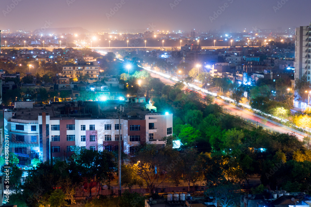 Fototapeta premium Noida cityscape at night showing lights, buildings and residences. Shows the urbanization and development of Delhi