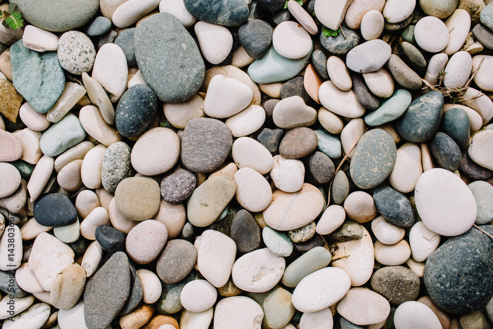 Neutral pattern of pale stones. Flat lay, top view Neutral pattern of pale stones. Flat lay, top view