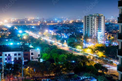 Noida cityscape at night showing lights, buildings and residences. Shows the urbanization and development of Delhi