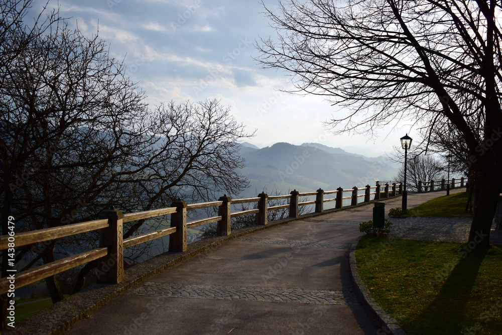 Road to the viewpoint. Footpath along wooden parapet at sunset. Road to the viewpoint. Footpath along wooden parapet at sunset.