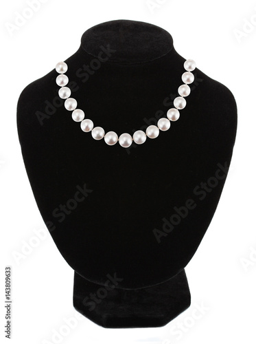 Pendant with gem stones pearls on black mannequin isolated on white