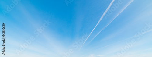 contrails and blue sky photo