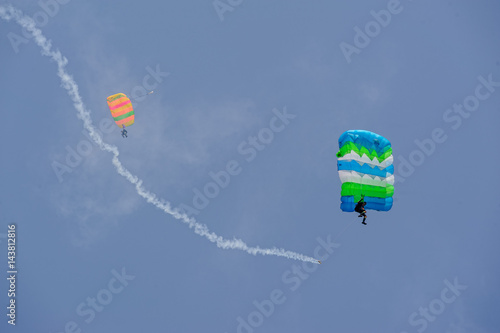 Tyumen, Russia - August 11, 2012: On a visit at UTair air show in heliport Plehanovo. Paratrooper man landing in show program