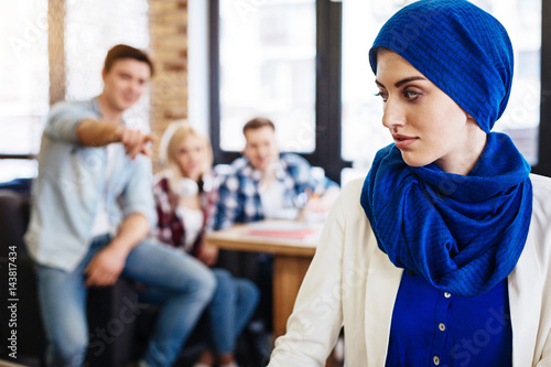 Принти на полотні Group of students humiliating young muslim woman