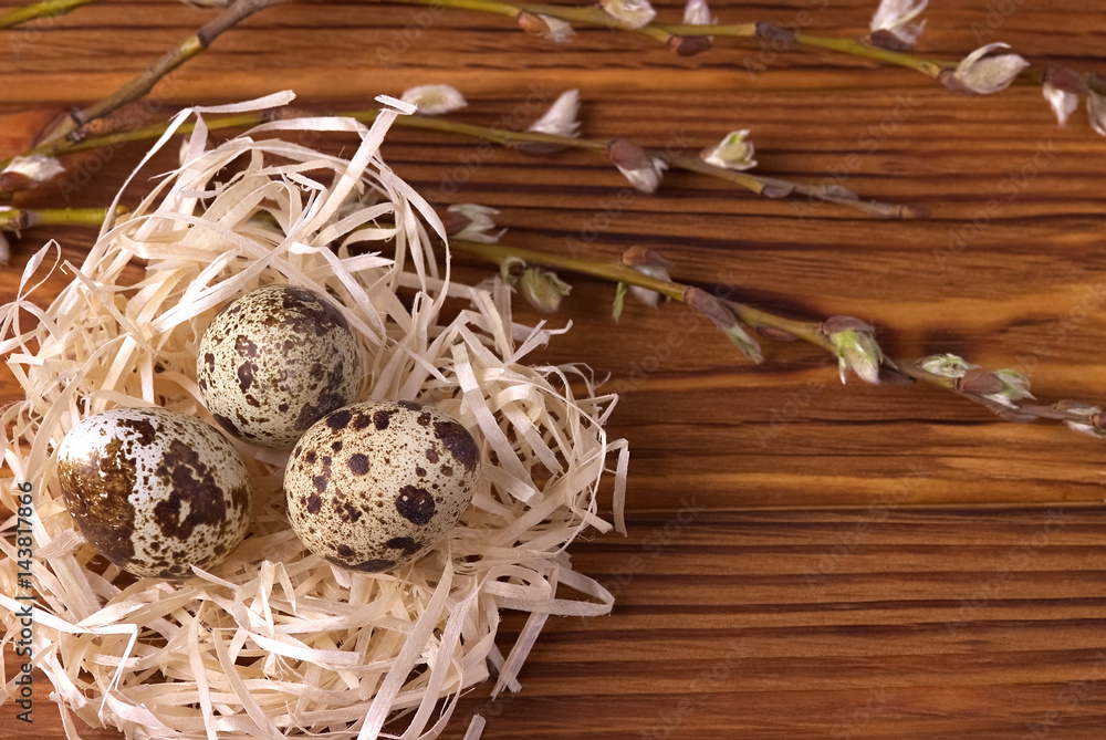 Easter decoration, Easter eggs in the nest on brown wooden background. Easter decoration, Easter eggs in the nest on brown wooden background.