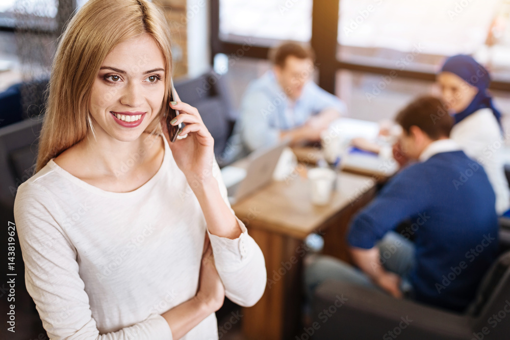 Cheerful beautiful woman talking on smart phone Cheerful beautiful woman talking on smart phone