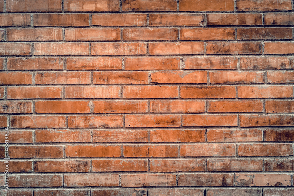 Old red brick wall with cracks and scratches. Horizontal wide brickwall background. Distressed wall with broken bricks texture. Vintage house facade. Old red brick wall with cracks and scratches. Horizontal wide brickwall background. Distressed wall with broken bricks texture. Vintage house facade.