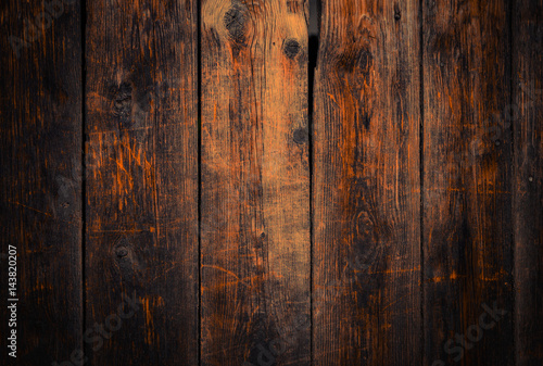 Obraz na płótnie Old rural wooden wall in dark brown and orange colors, detailed plank photo texture. Natural wooden building structure background. w salonie