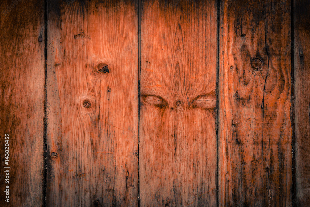 Old rural wooden wall in dark brown and orange colors, detailed plank photo texture. Natural wooden building structure background. Old rural wooden wall in dark brown and orange colors, detailed plank photo texture. Natural wooden building structure background.