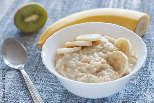 Healthy homemade oatmeal with banana for breakfast