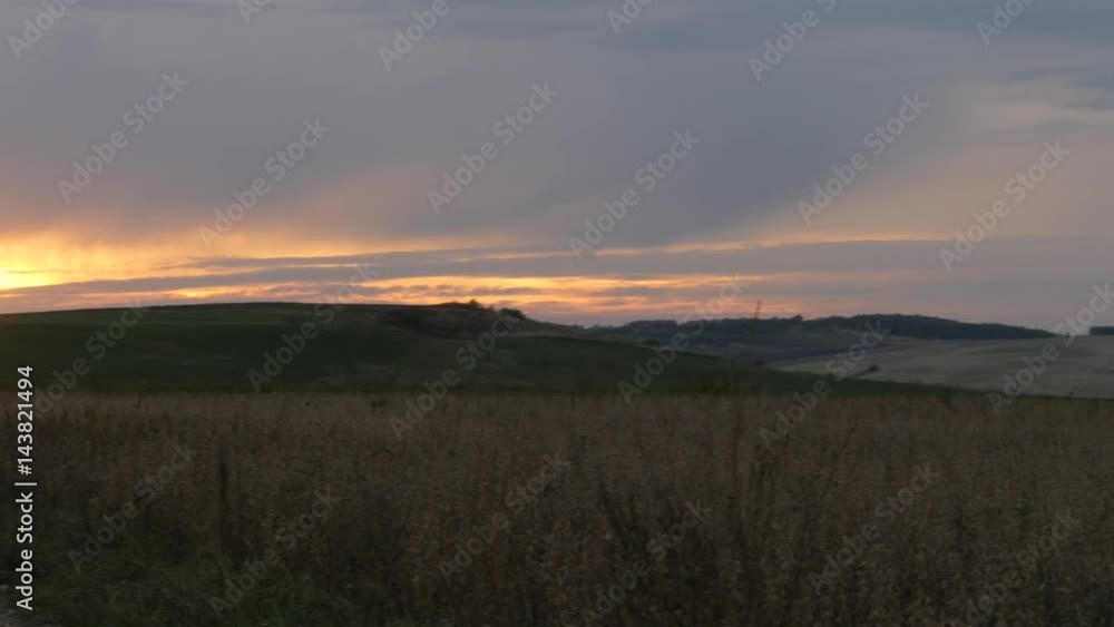 Church Bell Tower on a Horizon at the Field Sunset at Open Space Beautiful Evening Landscape Steppe in Ukraine Grass is Swaying at the Wind Walk by Path Church Bell Tower on a Horizon at the Field Sunset at Open Space Beautiful Evening Landscape Steppe in Ukraine Grass is Swaying at the Wind Walk by Path