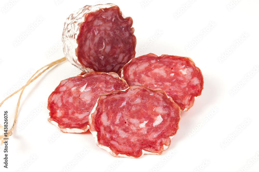 pile of red salami, on a white pile of red salami, on a white