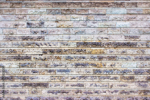 The gray wall of stone bloc...