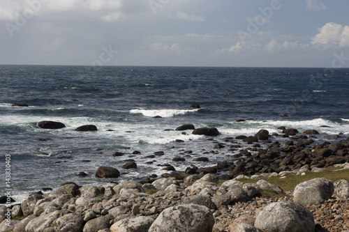 Waves hitting rocks at shore