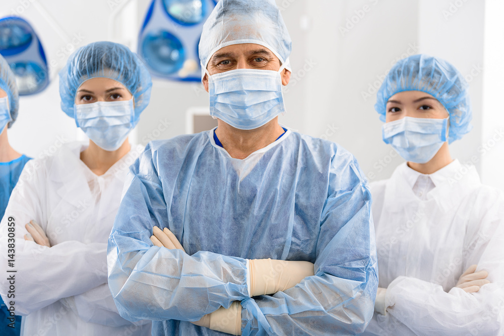Happy glancing team of doctors Happy glancing team of doctors
