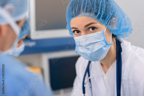 Serious glance of female doctor