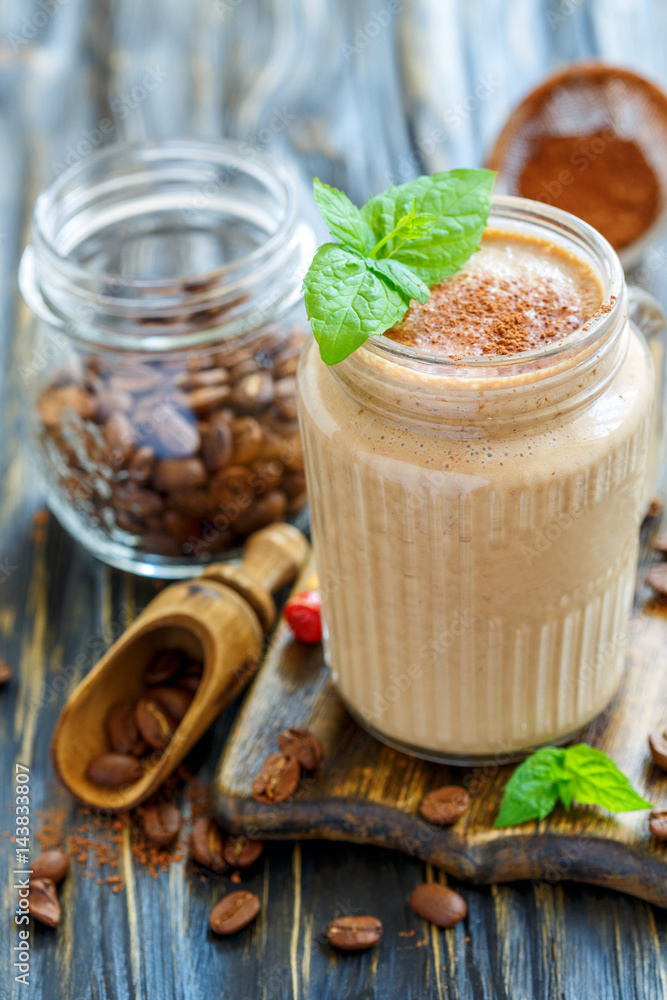Invigorating coffee smoothie in a glass jar. Invigorating coffee smoothie in a glass jar.