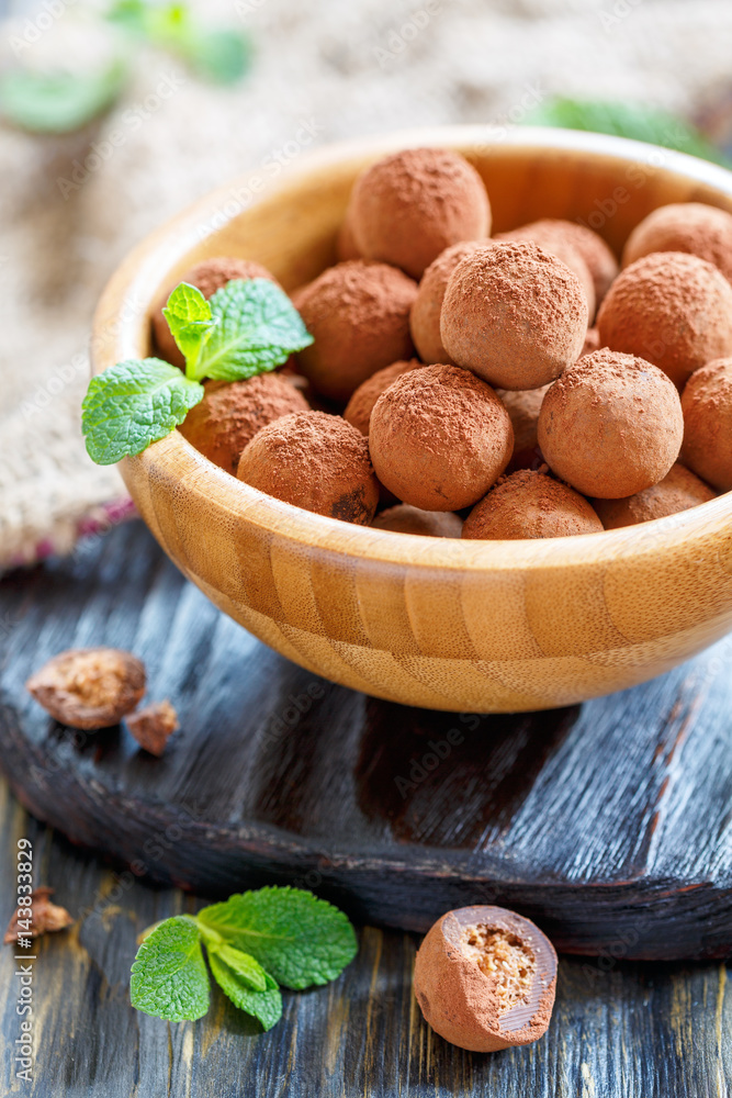 Wooden bowl with homemade chocolates. Wooden bowl with homemade chocolates.