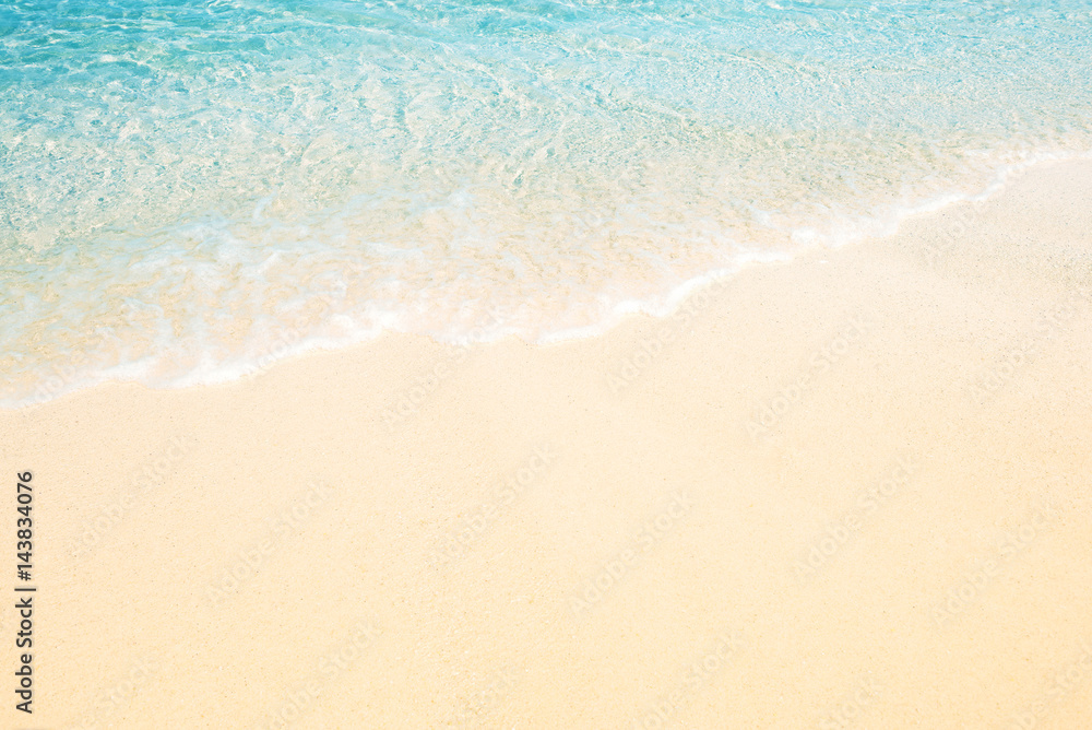 Soft wave of the sea on the sandy beach for background