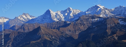 Snow capped mountains Finsteraarhorn, Eiger, Monch and Jungfrau. Famous mountains in Switzerland. View from mount Niesen.