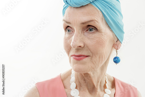 Thoughtful senior lady with stylish clothing
