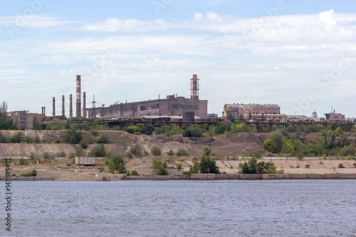 Panoramic view of ironworks on river coastline