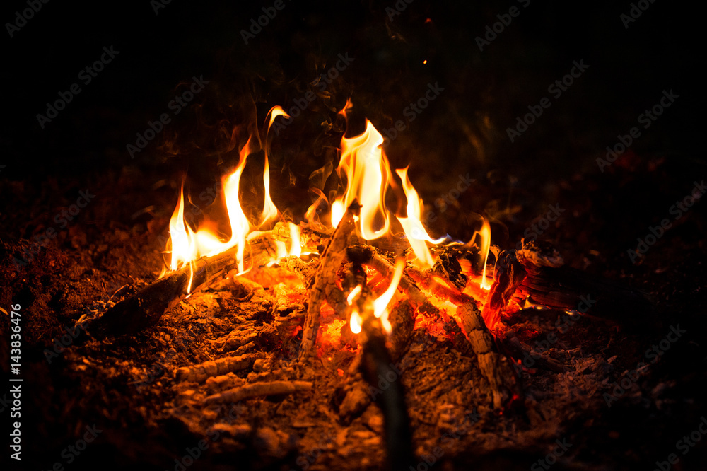 Fire sparks and flames in motion on black background. Texture and eruption Fire sparks and flames in motion on black background. Texture and eruption