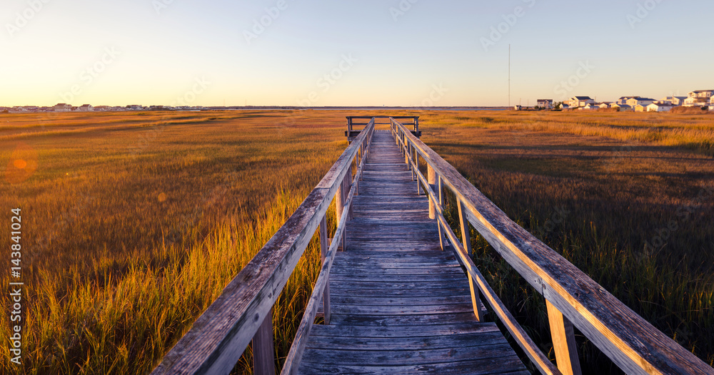 old wooden dock at sunset