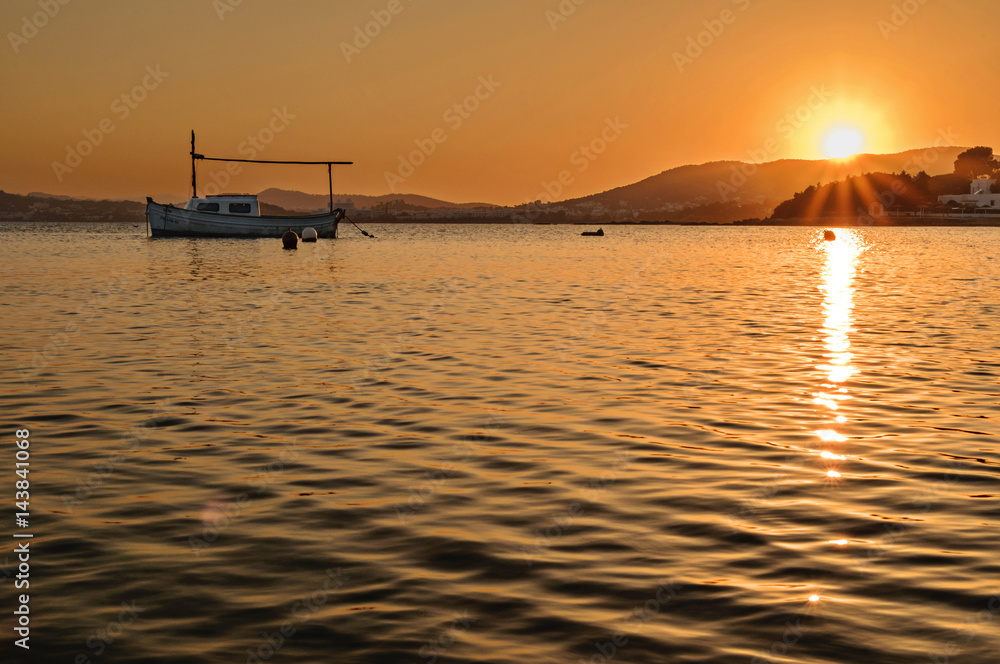sunset over the calm waters of the sea, ibiza, spain