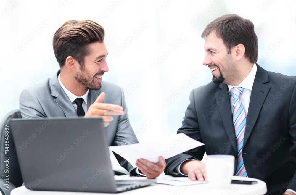 Image of two business people interacting at meeting in office Image of two business people interacting at meeting in office