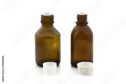 Vial of medicine without a lid on a white background