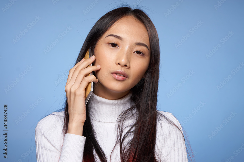 blue background and woman with phone blue background and woman with phone